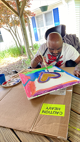 cedric-painting-resized main painting a heart on a canvas