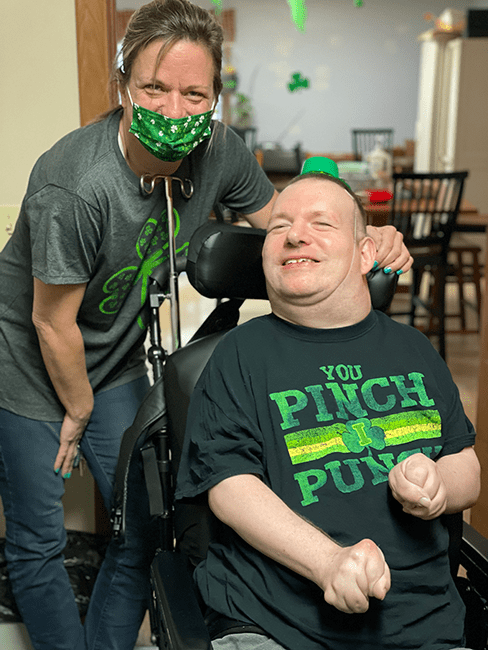two people smiling with st. patrick's day festive wear
